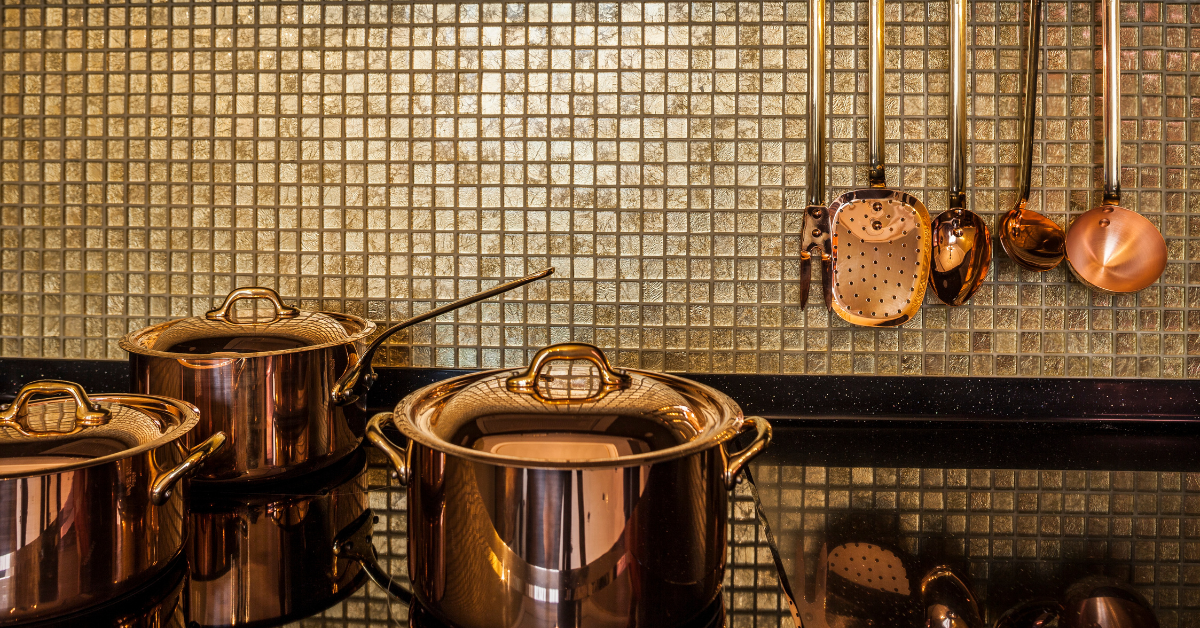 Kitchen Utensils: A comprehensive set of kitchen utensils, including whisks, spatulas, wooden spoons, and measuring cups, essential for any kitchen.