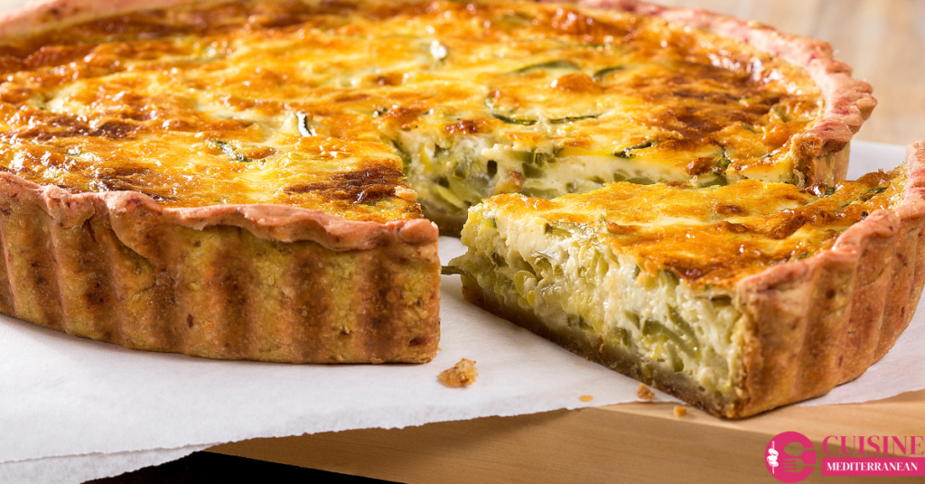 Mediterranean quiche dish filled with spinach, feta cheese, and olives.